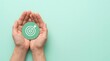 © Masque - A pair of hands holding a circular target paper representing a business vision plan concept.