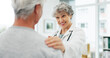 © peopleimages.com - Consultation, healthcare and doctor with senior woman in hospital for advice in discussion. Happy, professional and medical worker with elderly female patient for help at checkup in clinic office.