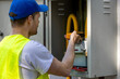 © ronstik - Technician checking natural gas leak with detector in meter box. Gas maintenance and repair service