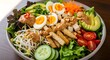 © Andra - Healthy Salad Bowl with Tofu, Egg, Avocado, and Peanut Dressing