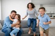 © VideoFlow - Happy family having fun together in bright modern living room. Ai generative