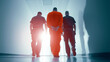 © Bonsales - Officers escorting a handcuffed man in an orange prison uniform down a brightly lit hallway, representing legal proceedings and custody