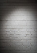 © .shock - Middle Eastern and young Arab business people in a creative startup coworking office against white brick wall backdrop