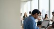 ©  S u n n y B u n n y - Indian Male IT Professional Working on Laptop in Modern Collaborative Tech Hub Office