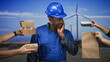 © Krakenimages.com - Man construction worker in blue hardhat touching cheek while multiple hands offer takeout boxes and a paper bag at windfarm; indecision choices.