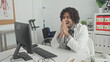 © Krakenimages.com - Man doctor in white coat with stethoscope raises fists and smiles at computer in building after good news; professional joy.