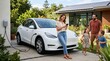 © Unimaginable Pic - Smiling family standing near charging electric car with solar panels on modern home roof