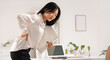 © Pixel-Shot - Beautiful young Asian businesswoman with folders suffering from back pain in office