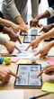 © MstAsma - Collaborative teamwork diverse hands interacting with digital tablets on a table