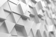 © VERSUSstudio - White triangular block pattern with shallow depth of field for abstract background and surface texture design applications .3d render