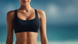 © Keopaserth - Female torso black sport bra athletic body fit woman slim waist healthy skin studio portrait cropped body blue background fitness fashion exercise wear toned abdomen shoulder arm chest posture