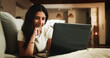 © peopleimages.com - Laptop, streaming and relax with woman on sofa in home for movie subscription, entertainment and calm. Film platform, weekend break and online show with female person in living room in apartment