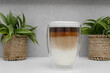© Paweł Kacperek - Close-up of a cup of coffee, espresso with milk, latte macchiato with Arabica beans