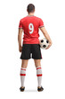 © Ljupco Smokovski - Football player standing from behind with a ball and jersey number 9