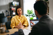 © djile - Businesswoman listening to client during professional consultation