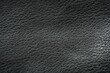 © Анна Климчук - macro texture of black biker leather jacket viewed from top. Close-up of genuine or synthetic leather surface showing natural grain, subtle wrinkles, and matte to slightly glossy finish. Minimal and s