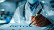 © Aliaksandra - Doctor writing the word detox with a glowing marker, concept image for health, cleansing and wellness treatment