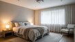 © 00adobestock23 - A serene and modern bedroom with a large window and comfortable bed