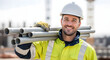 © DEXTEROUA - construction worker on site holding pipe