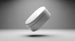 © rahul - A white wireless earbuds floating in midair on a gray background with a shadow underneath
