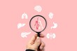 © Wiwi - Human anatomy concept with magnifying glass highlighting internal organs and body systems. Ideal for medical research, biology education, and healthcare analysis visuals