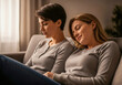© Vico - Two friends relaxing on sofa, enjoying calm and comfortable time at home