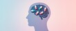 © Giuseppe Cammino - Capsules create clean brain silhouette on pastel background, mental health