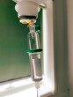 © ellinnur - Iv drip running with saline close up in a hospital.
