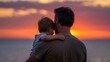 © mila103 - Father holding child facing sunset over ocean shoreline