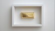 © Gendar SINURO - Top View of Single Shiny Gold Bar in White Frame