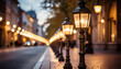 © sofa - Glowing vintage street lamps along historic city avenue at dusk.