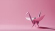 © Camalia MN - Origami crane on pale pink background