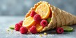 © Wonder Gallery - A waffle cone overflowing with vibrant citrus segments and plump raspberries, sprinkled with sugar, creating a delightful summery still life