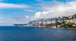 © Aerial Film Studio - Monaco skyline hugs coastal cliffs on the French Riviera. Le Rocher sits left, Tour Odeon and beaches right, terraced villas and corniche roads frame under morning light.