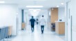 © Naz Piczz - Blurred Hospital Corridor with Two Figures Walking Away hallway outoffocus