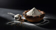 © PureShot - A rustic wooden bowl filled with white all purpose flour beside a measuring cup on a dark textured background with wheat grains for professional baking