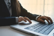 © Chutima - The hands of a professional businessperson are intently typing on a laptop keyboard. Work and communication are essential.