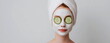 © Phanupong - Young woman with white facial mask and cucumber slices on eyes relaxing at home skincare treatment self care beauty routine calm wellness moment copy space