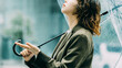 © Trickster* - 雨の日に傘をさす日本人女性・ビジネスウーマンのイメージ（LP・バナー向け）, Japanese Businesswoman with Umbrella on Rainy Day