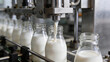 © 琛明 周 - Milk Bottling Process: A close-up view captures the automated milk bottling process, showcasing the precision and efficiency of modern dairy production.