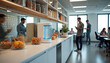 © Viktor - Modern office break room with healthy snacks and water dispenser. Employees take a break, relax, and recharge at work. People chat and use phones in casual workplace setting.