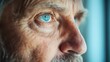 © Larisa AI - A close-up of an elderly man's face highlighting his striking blue eyes, conveying profound wisdom, experience, and reflection in a relatable human moment.