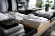 © Milos - The image showcases a meticulously organized display of white shirts, emphasizing simplicity and elegance in modern retail design, perfect for fashion enthusiasts and shoppers.
