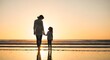 © Bappy - Mother and child silhouettes at sunset on a beach