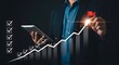 © GOKULRATAN - Business growth and innovation a man interacting with a digital financial chart
