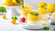 © Silvia Bogdanski - Zitronendessert mit frischen Früchten und Minze modern präsentiert