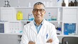© Pandi - Smiling scientist in a lab