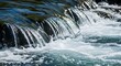 © Pencari - Crystal clear water cascades over smooth rocks, creating foamy white rapids and sparkling light reflections