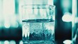 © PikePicture - Glass beaker containing liquid bubbling in laboratory