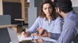 © insta_photos - Mentoring young male Hispanic teacher and latin indian female student working together discussing course work. Insurance agent manager explaining conditions to client.